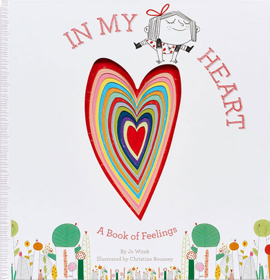 Set against a textured white background, the central focus is a large, die-cut shape of a heart layered with concentric, multicolored borders including shades of red, pink, yellow, blue, and green.The main title, 